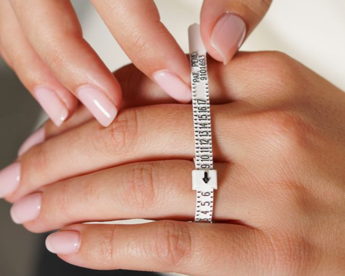 Ring sizer and rings used to measure your perfect ring size at home