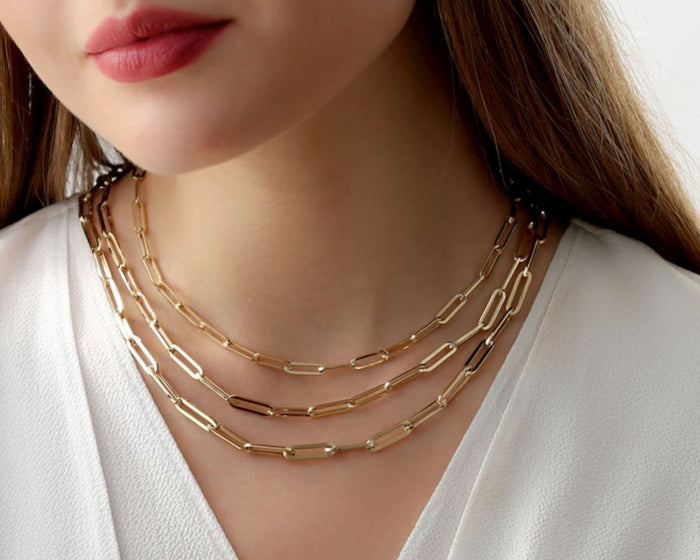 Gold paperclip chain necklace and bracelet styled together for everyday layering