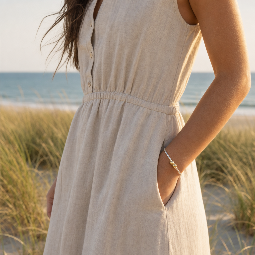 Coastal Double Ball Bracelet in Sterling Silver with 14k Gold Filled Balls, worn by a model, Ideaure photo