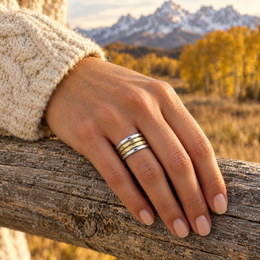 Hammered Four Band Stack Ring worn on a hand, cedar rail and golden aspens, Ideaure photo