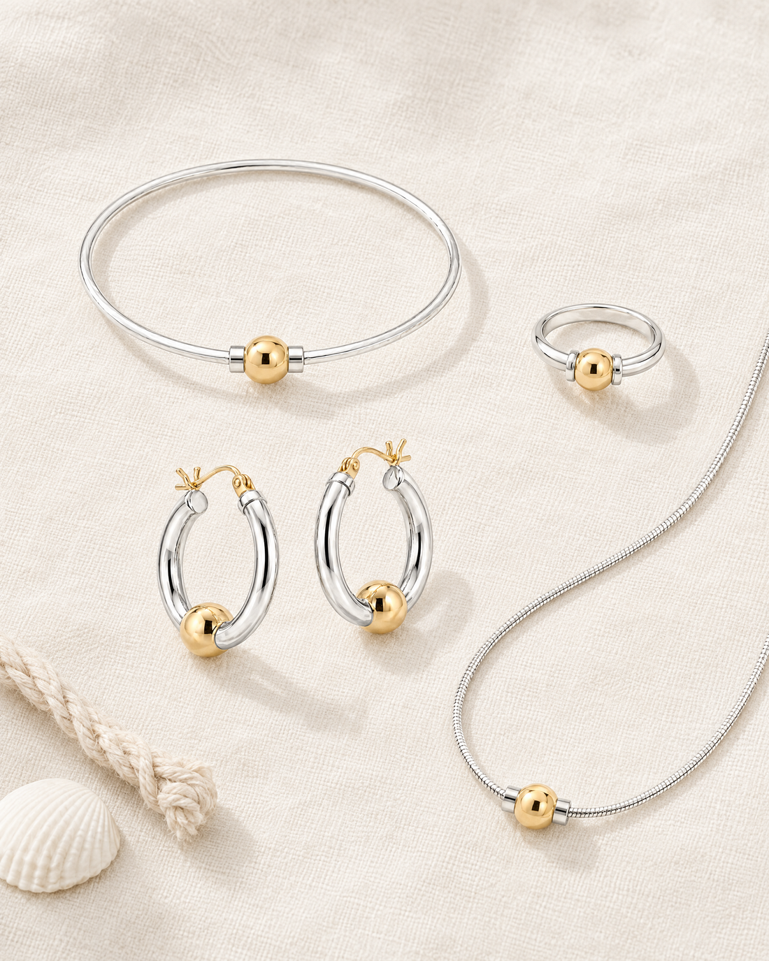 Coastal Ball Bracelet with the matching Coastal Ball Ring, Hoop Earrings and Necklace, flat lay