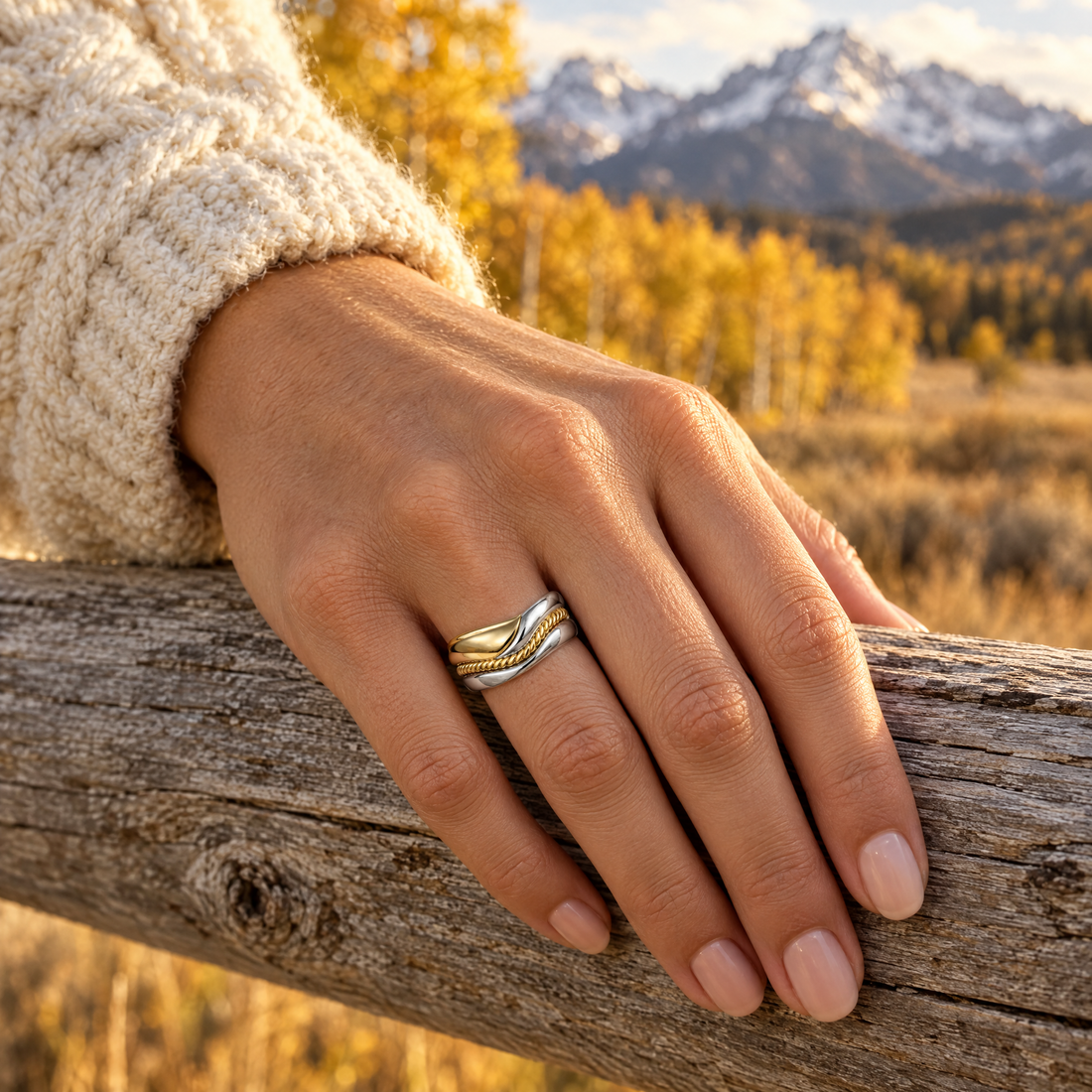 Rope Wave Stack Ring worn on a hand, cedar rail and golden aspens, Ideaure photo