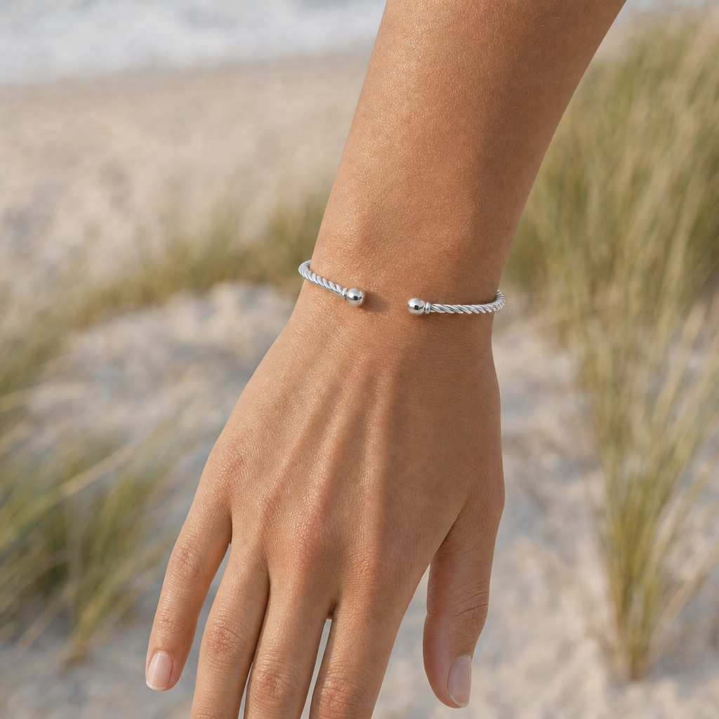 Seabrook Twist Cuff Bracelet in All Sterling Silver, worn by a model, Ideaure photo