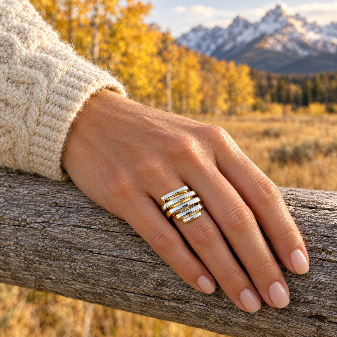 Staggered Bar Ring worn on a hand, cedar rail and golden aspens, Ideaure photo
