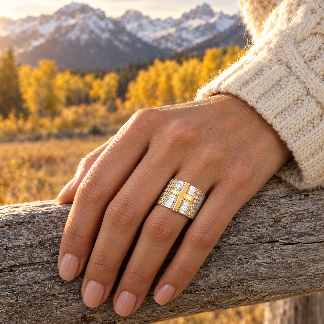 Wide Hammered Cross Ring worn on a hand, cedar rail and golden aspens, Ideaure photo